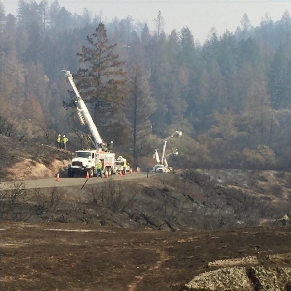 Lineworkers from SMUD help restore power after wildfires crippled parts of the power grid in Napa Valley, Calif. earlier this year.
