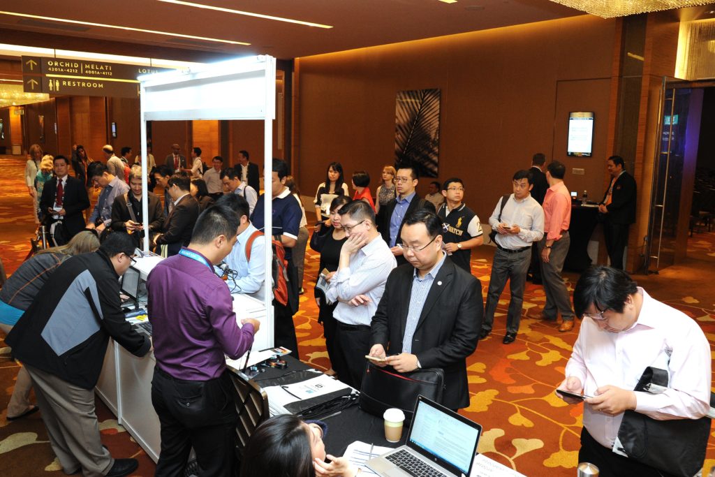 Volunteers check attendees into the CSX AP event in Singapore in 2016.