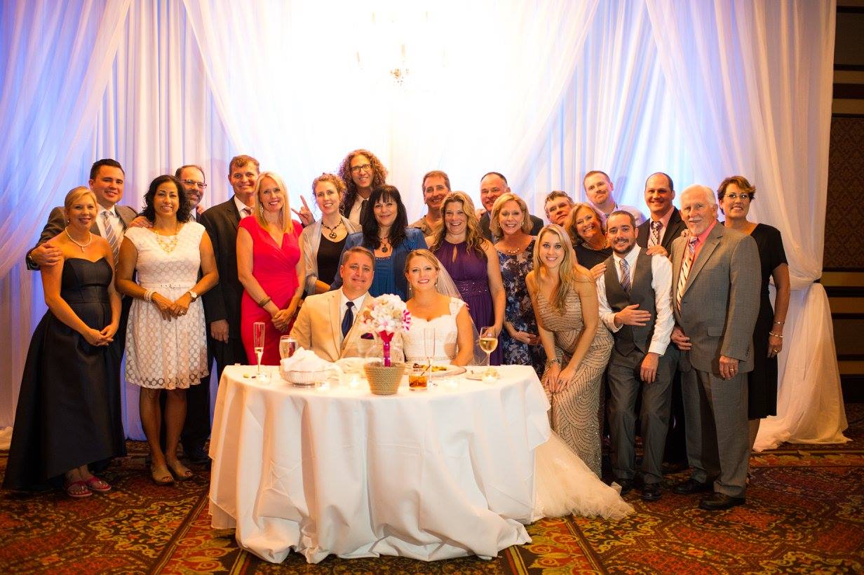 A group of Naylorites celebrates with Anthony and Amanda Land at their wedding. Photo by Rya Duncklee/Ryaphotos.