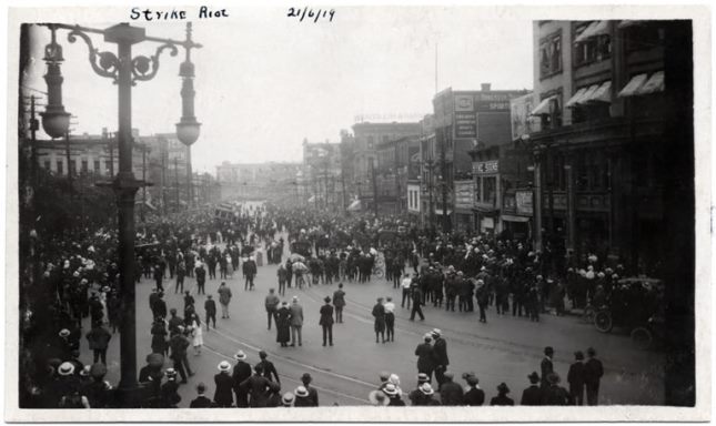 Crowd beginning to tip a streetcar on Main Street near Market Avenue. June 21, 1919. Photo courtesy of MBT and the Manitoba Archives.