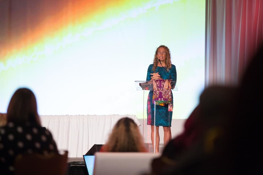 Rethreaded founder and CEO Kristin Keen speaks to FSAE's Annual Conference before the Rethreaded pop-up shop opened outside the auditorium.