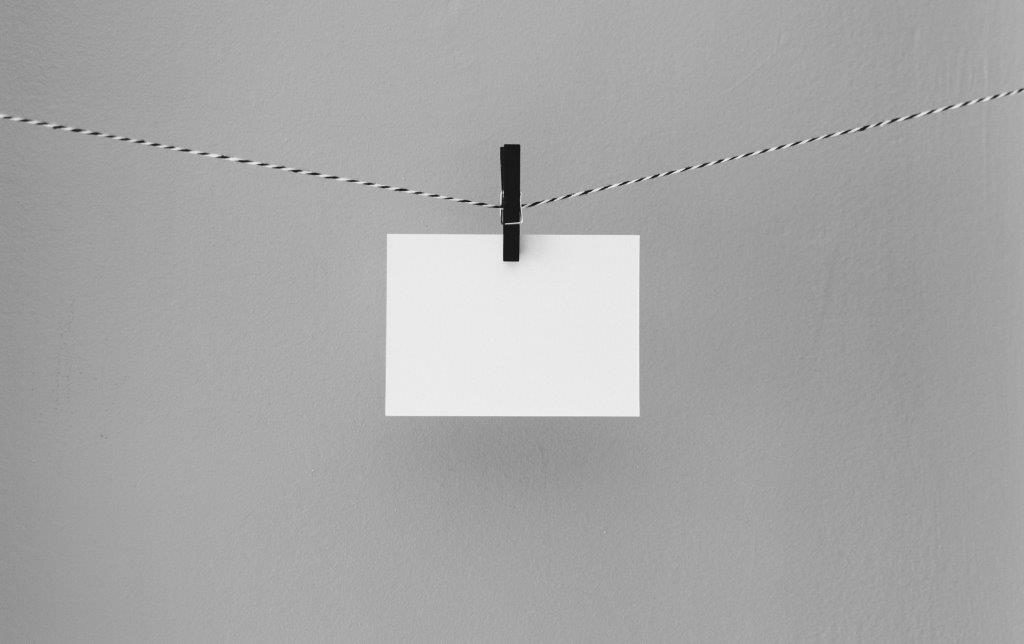 Blank note hanging from a clothesline
