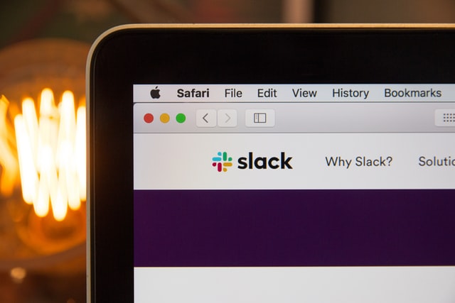 Slack app showing on a computer screen by Stephen Phillips Unsplash 640px